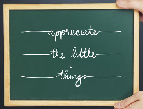 Chalkboard reading 'appreciate the little things' to help stop being sad about life and disappointment