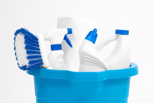 Variety of cleaning products in a bucket