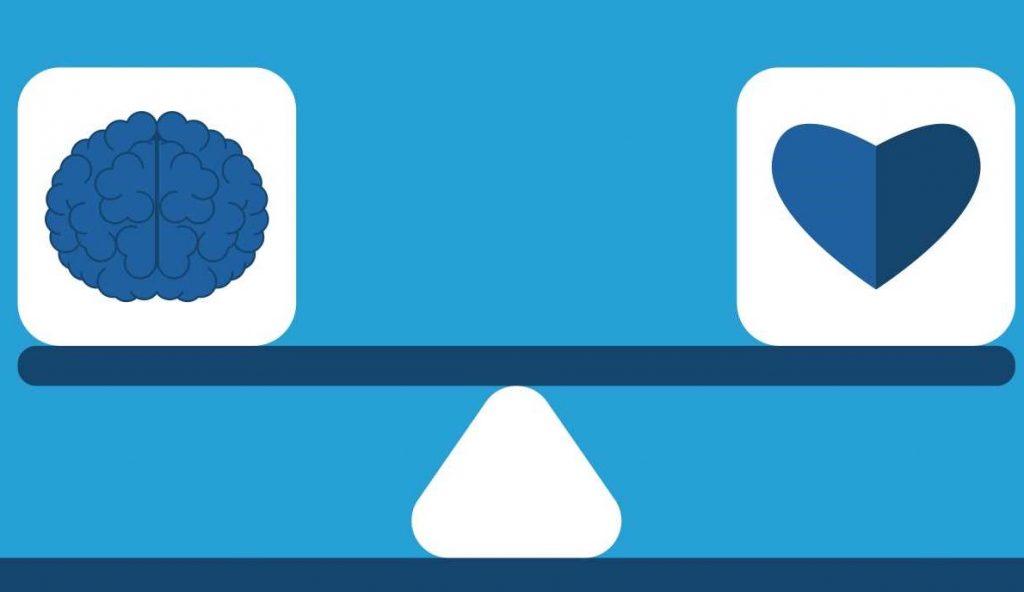 scales balancing heart (emotions) and brain (logic)