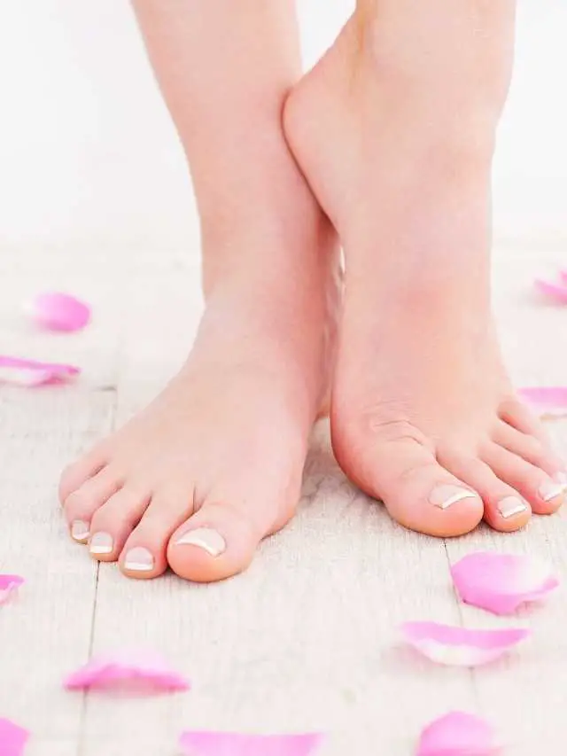 Image shows clean bare feet with flower petals strewn on floor after deodorizing shoes to keep them from developing odor