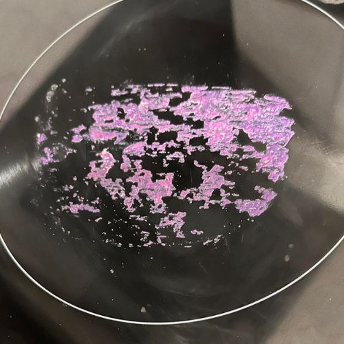 Image shows melted plastic on black glass stove top