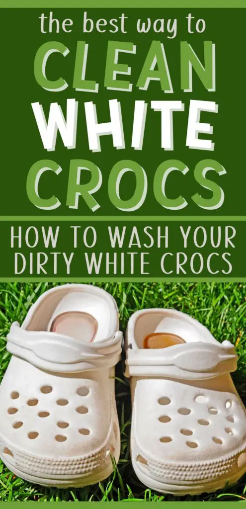 Pin text reads "the best way to clean white crocs - how to wash your dirty white crocs." Image is a pair of dirty white crocs on strands of green grass before using these ways to clean dirty white crocs