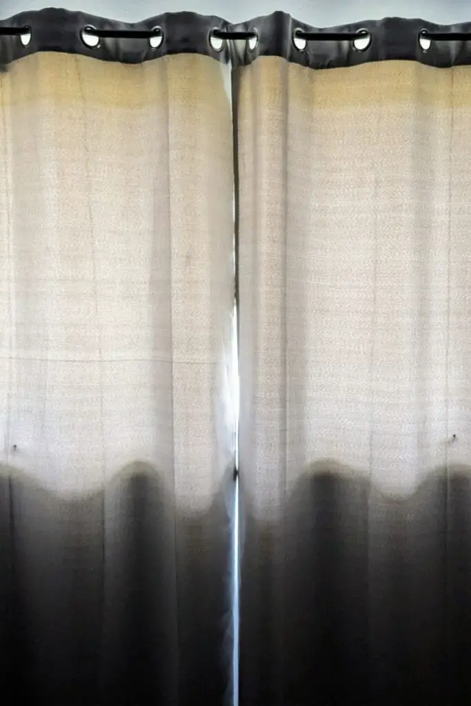 Image of grey lined curtains used in our spare room to block heat from windows