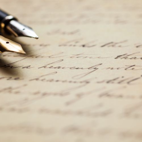 Handwritten letter and pens