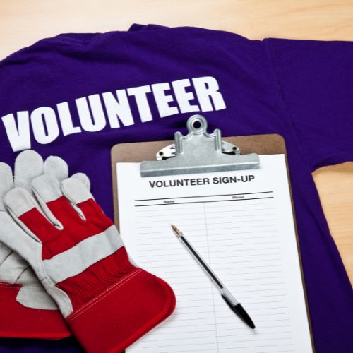 A volunteer t-shirt, gloves and a roster