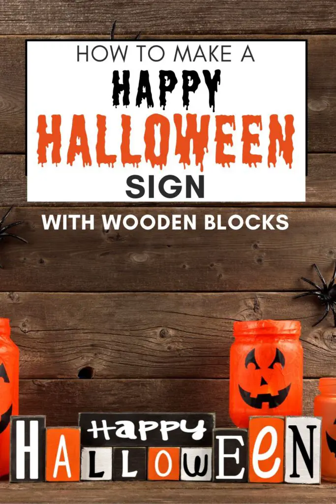 Pin text reads How to make a happy Halloween sign with wooden blocks. Background image is a Happy Halloween sign on a table with mason jar pumpkins