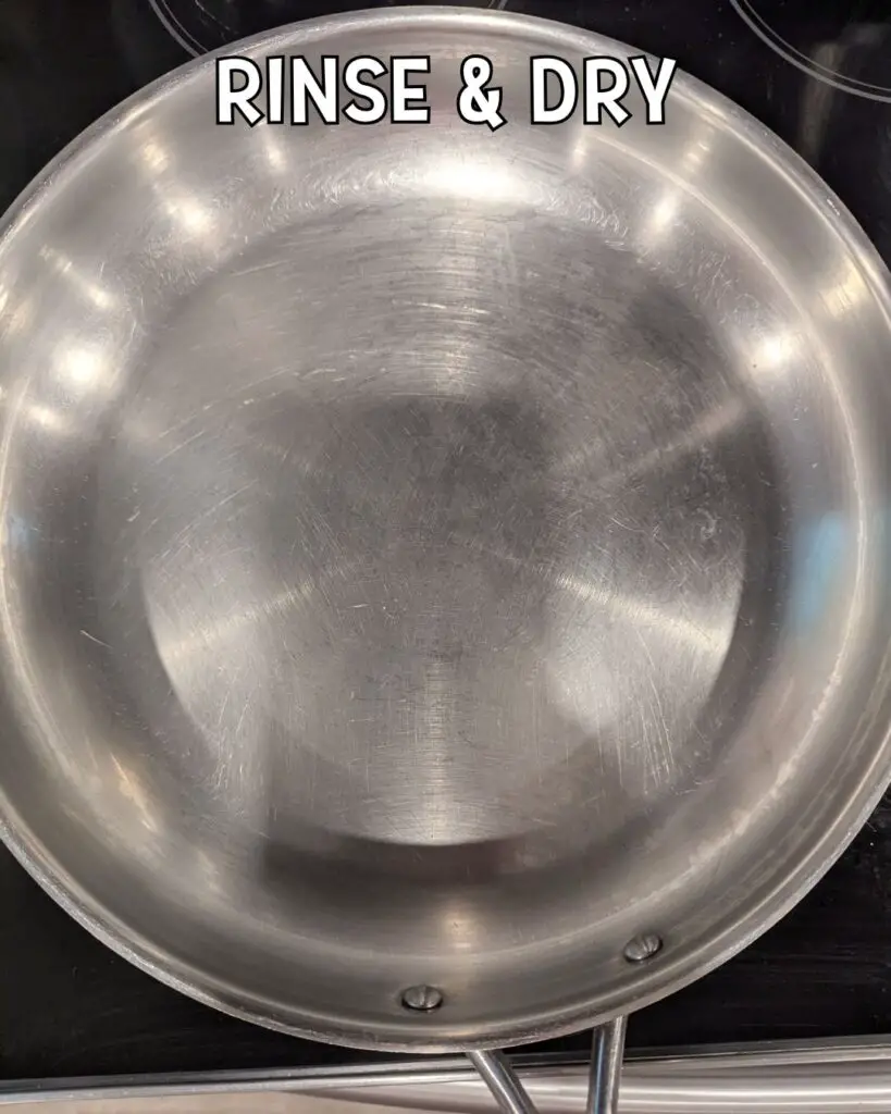 A stainless steel pan is shown on a stovetop with the text "RINSE & DRY" above, suggesting the next steps after removing burnt food from the pan.