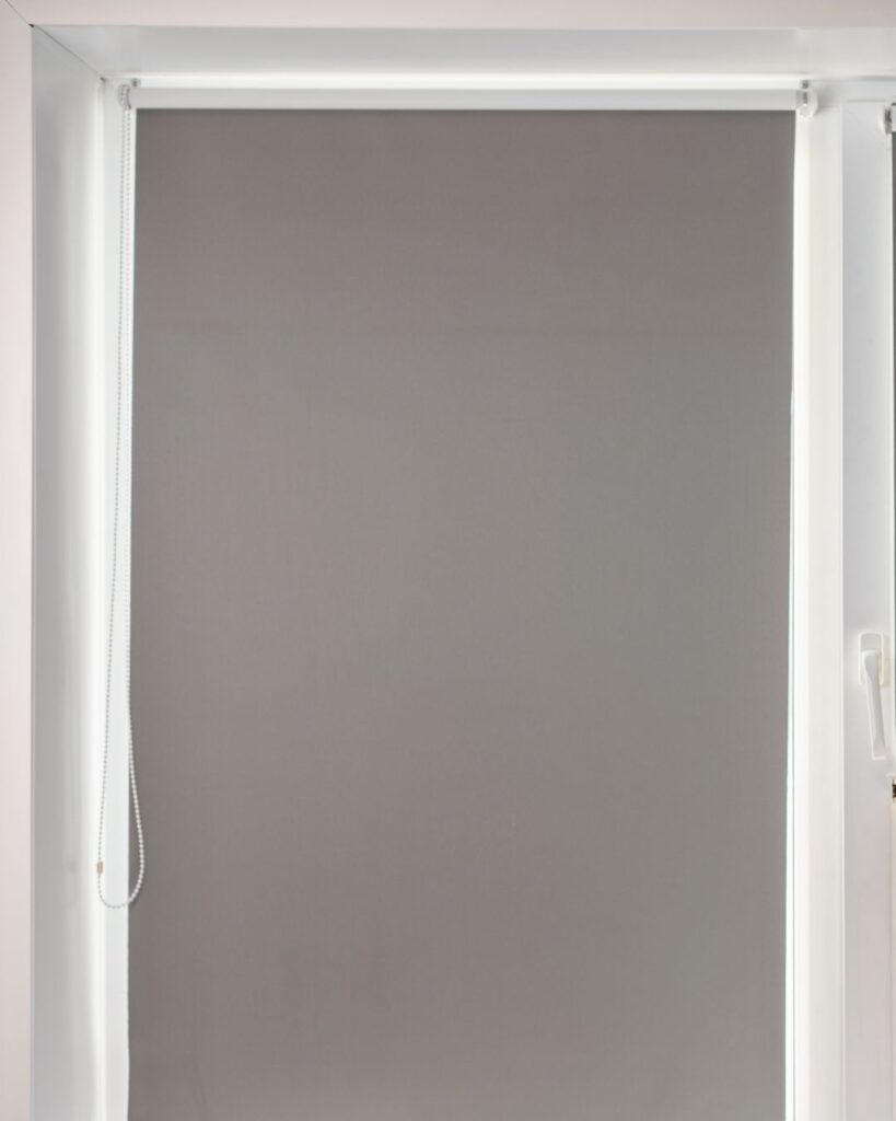 Grey window blinds to block sun from windows